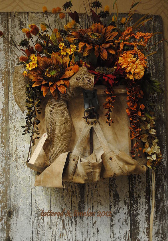 autumn home decorations, chalkboard paint, crafts, flowers, seasonal holiday decor, wreaths, This is an old apple pickers bag that is holding my floral arrangement in a not so traditional wreath entry