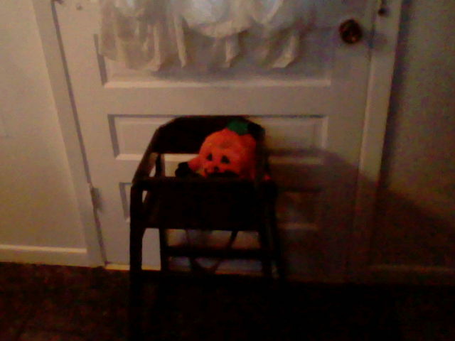 halloween decorating with black and white, halloween decorations, seasonal holiday d cor, wreaths, For the Grand children I painted a wooden high chair black and propped a pumpkin in it