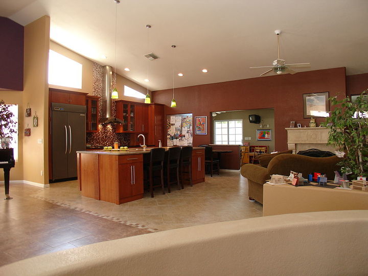 We made numerous modifications to our homeowners' kitchen to accommodate their needs, such as removing a wall to open up the kitchen to the rest of the home; installing a functional new island with an abundance of storage space and seating area; installing all new contemporary kitchen cabinetry, counters, appliances, lighting, windows and fixtures; and modifying a wall on the far side of the kitchen to open the floor plan..