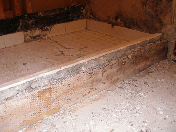 shower renovation, bathroom ideas, tiling, In an older house the shower floor was up to 4 inches thick with cement A hammer jack works best to break up the concrete