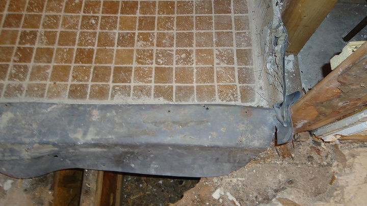 good example of a failing shower due to incorrect installation and having to do it, home improvement, Well after we got the curb up we had nails through the top of the curb and the membrane was cut in the corners