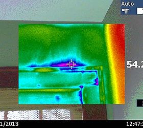 recent infrared scan of a newly renovated room, home maintenance repairs, wall decor, Blue and purple colors showing air leaking out and into the house