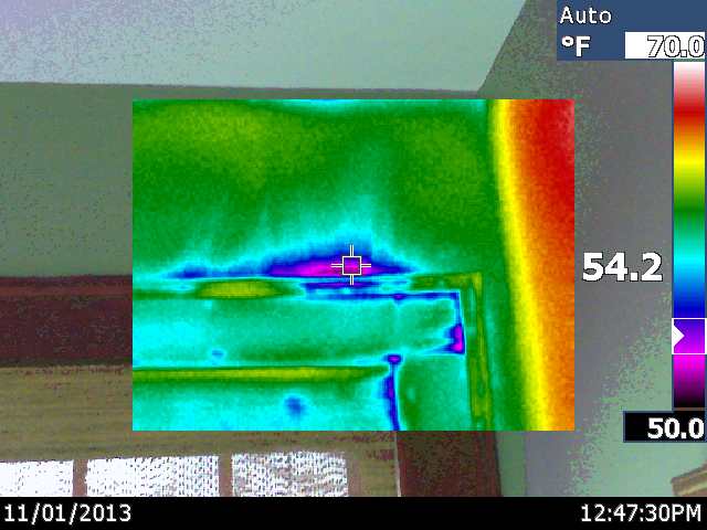 recent infrared scan of a newly renovated room, home maintenance repairs, wall decor, Blue and purple colors showing air leaking out and into the house