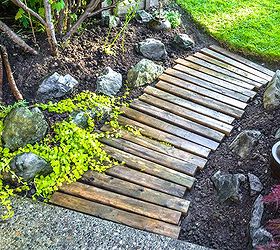 decorating from nothing to something a junker s full home tour, home decor, outdoor living, repurposing upcycling, Creating a walkway is as easy as a few pallet boards tucked into place