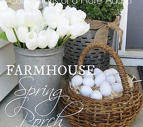 a farmhouse porch for spring, porches, seasonal holiday decor, windows, wreaths, A simple and rustic farmhouse look for the front porch this spring starring a 10 olive bucket from Walmart a galvanized sap bucket filled with faux tulips and a basket of realistic eggs to complete the look