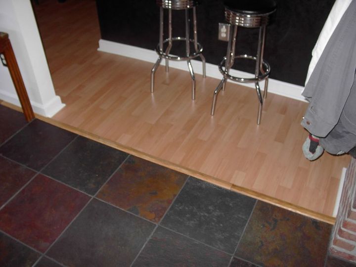 slate floor in living area, Slate to laminate floor wood transition strip one of two