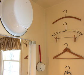 decorating a small bathroom, bathroom ideas, home decor, small bathroom ideas, There s something about a grouping of almost anything that makes an impact Here is a column of vintage hangers
