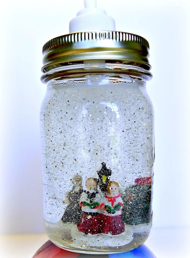 dollar store mason jar snow globe soap dispensers, crafts, mason jars, seasonal holiday decor, Carolers in the snow