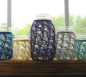 2013 hot decorating trend 11 anything embroidered knotted knitted ribbed or, home decor, mason jars, shabby chic, Once again mason jars get another use with knitted wraps in fun colors