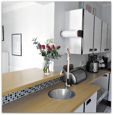 kitchen make over the budget friendly way, countertops, home decor, kitchen design, tiling, Prep area and a glimpse into the scullery laundry We opened up a counter here for easy dumping of dirty dishes and collecting clean dishes