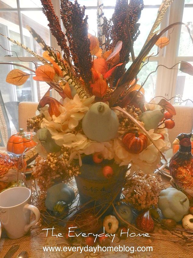 decorating a blue breakfast room for fall, seasonal holiday decor, Hydrangeas berries pheasant feathers millet and blue painted pumpkins and pears Yep I said blue