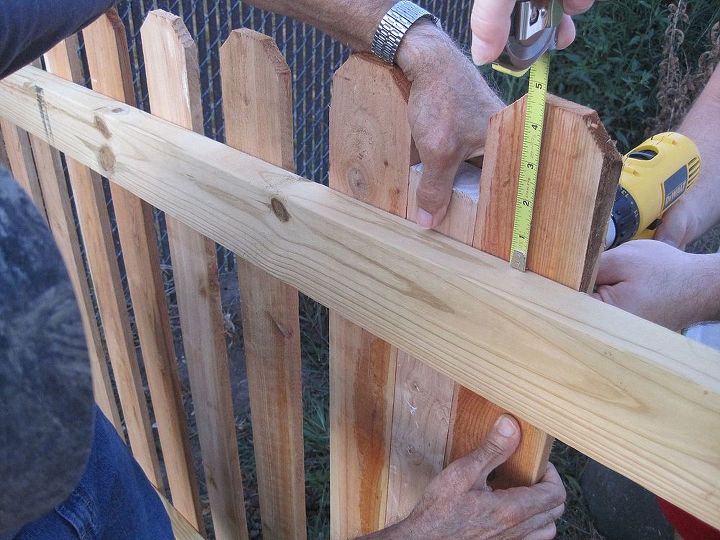 tips for building a fence, diy, fences, how to, woodworking projects, Now start adding your pickets You can drill them or nail them in your choice but we chose to drill them in You can find the entire tutorial on my blog at