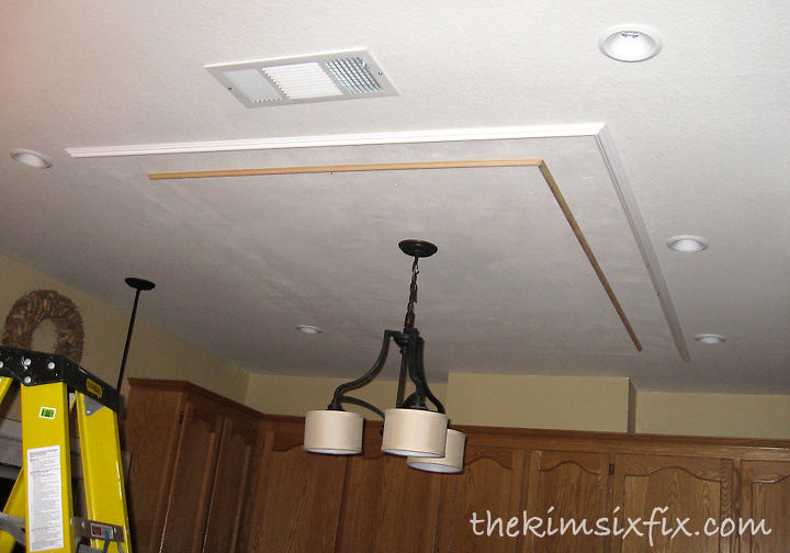 replacing updating fluorescent ceiling box lights with ceiling molding, home maintenance repairs, kitchen design, lighting, woodworking projects, Adding molding to the ceiling masks the drywall patch and adds architectural interest