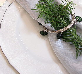 green white and silver christmas tablescape, christmas decorations, seasonal holiday decor, Fresh greens added ontop of the napkin