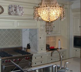 this apartment was designed for clients that used it as their home away from home in, home decor, kitchen island with antique chandelier custom cabinets