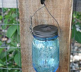 diy mason jar solar lights, crafts, mason jars, repurposing upcycling, I attached one to each fence post It looks really beautiful at night and pretty in the daytime too