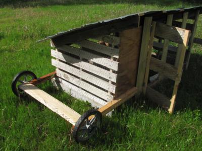 building a chicken tractor coop with recycled materials, homesteading, pallet, pets animals, repurposing upcycling, Recycled lawn mower wheels pallet We do winterize this tractor for harsh Montana weather