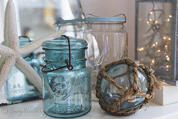 a bit of nautiical decorating with blue mason jars and flowers, home decor, Vintage blue mason jar and a blue glass fishing float They pair nicely together