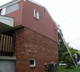 how we painted our aluminum siding with brushes, curb appeal, painting, We had to use a super tall extension ladder to reach the highest points of the house so safety was very important