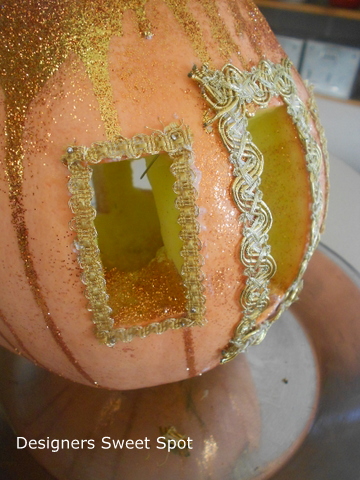 how to make a cinderella pumpkin coach, crafts, gardening, seasonal holiday decor, Next step was to glue on some scraps of gold braid