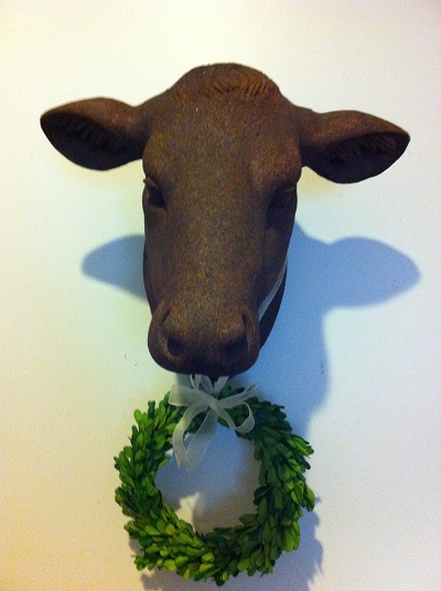new farmhouse decor, home decor, Love this calf head I added a boxwood wreath to pretty her up a bit