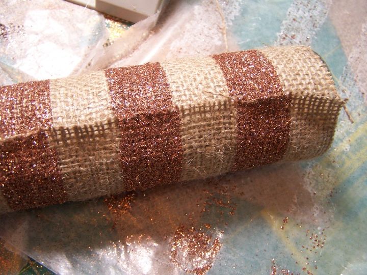 glittering striped burlap candle wraps, crafts, decoupage, seasonal holiday decor, Do you best to have the stripes match at the back seam I had not trouble with this by using the base of the candle as my match up point for rolling