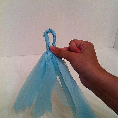 how to host a baby shower day three tissue paper bunting, crafts, home decor, Twist around and seal with hot glue and slide onto twine