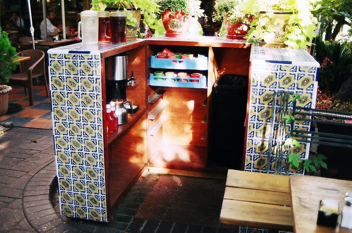 this some work i did for tower cafe on broadway in sacramento this is a destination, this is a outdoor coffee station coverd with tile and potted plants