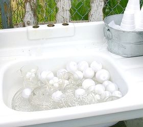 i have a sink ing feeling about this project, flowers, gardening, outdoor living, repurposing upcycling, Vintage sink filled with dessert ware and plastic holiday ornament bubbles