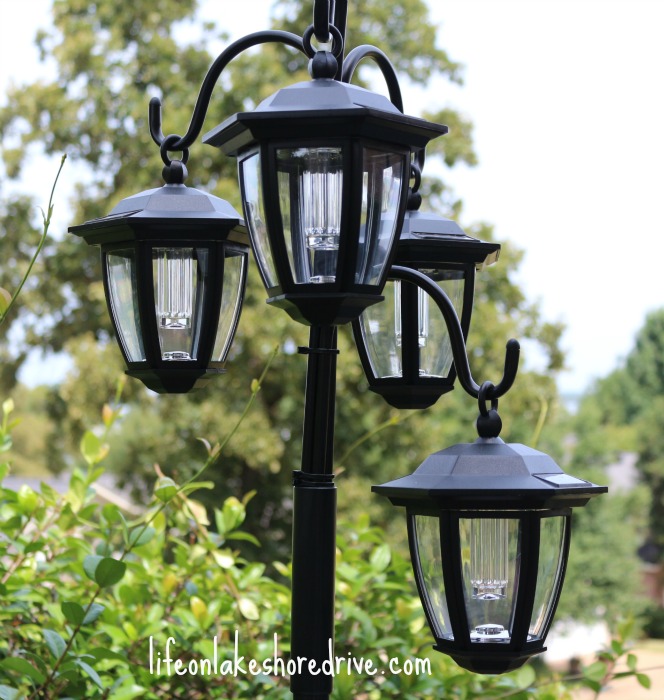 easy diy solar lights lamp post with flower planter, go green, landscape, lighting, outdoor living, I used cable ties to make the lamps varying lengths