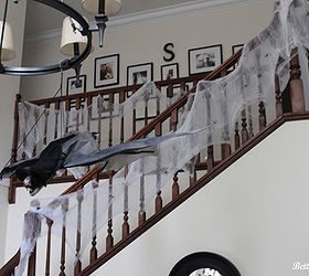 kids halloween party, halloween decorations, seasonal holiday d cor, Easy dollar store spider webs added to the staircase