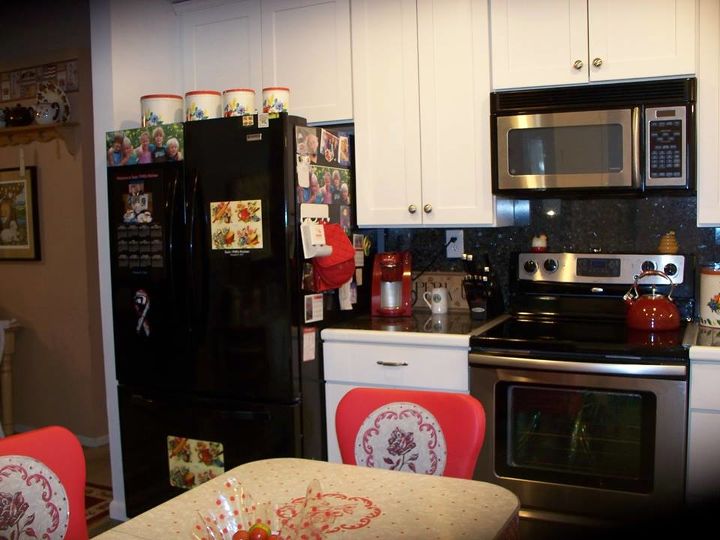 my 1940 s inspired kitchen renovation, home improvement, kitchen design, Fridge wall Found wonderful affordable solid wood cabinets at CliqStudios Lower cab has pull out drawers for pots and pans I got the range and microwave from separate sellers on Craigslist for a fraction of regular cost