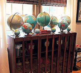 a tour of my favorite place in our home the living room, home decor, living room ideas, Part of my globe collection on top of my mid century modern cabinet I purchased at Restore for 100
