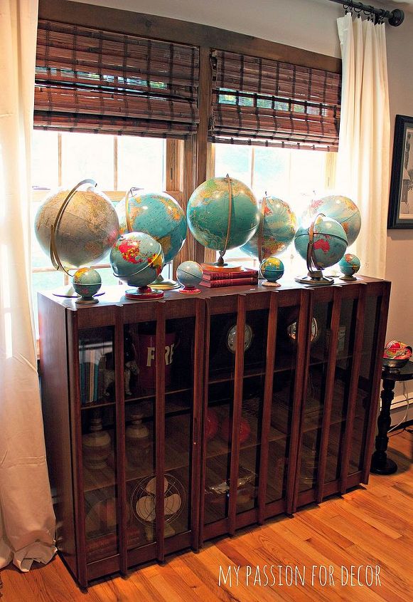 a tour of my favorite place in our home the living room, home decor, living room ideas, Part of my globe collection on top of my mid century modern cabinet I purchased at Restore for 100
