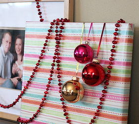 gift wrapped photo gallery wall, seasonal holiday decor, wall decor, Miniature glass ornaments tied with metallic ribbon and taped to the back give your gift wrapped frames add some whimsy dimension and interest