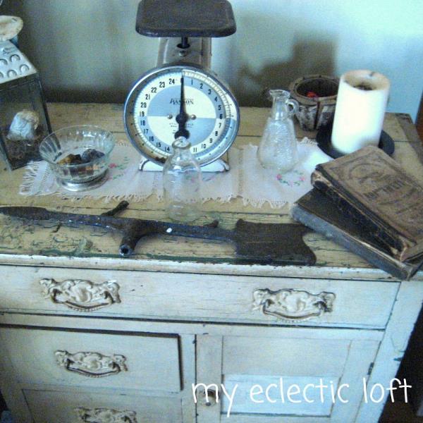 adding vintage decor to my home, home decor, repurposing upcycling, shabby chic, Antique washstand with a 1940 s candle holders vintage bowl part of an antique weather vane vintage books all displayed