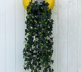 tire planters, gardening, repurposing upcycling, Tire planter mounted to deck wall