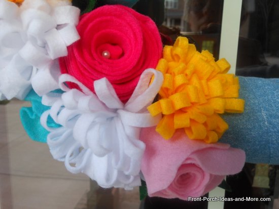 make a summer styrofoam wreath from a pool noodle, crafts, seasonal holiday decor, wreaths, I made rosette type flowers as well as a mum style out of coordinating colors of felt