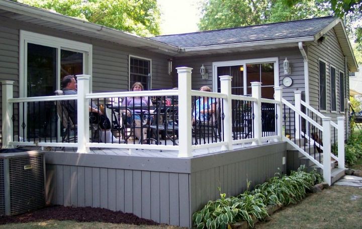 composite decks, decks, A composite deck with composite rail metal pickets and solid board skirting