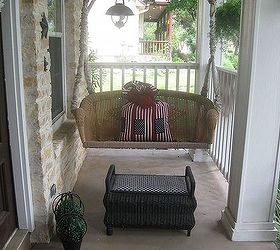 a patriotic porch, curb appeal, patriotic decor ideas, porches, seasonal holiday decor, wreaths, Giant firecracker lookin pillow to sink into while sippin tea on the porch