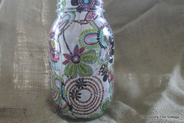 five ways to decorate mason jars, crafts, decoupage, mason jars, Learn how to Mod Podge fabric onto the inside of a jar with this easy tutorial