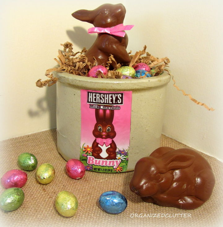 2 faux chocolate bunnies, crafts, easter decorations, seasonal holiday decor, I Mod Podged the candy wrapper on the crock and filled it with foil wrapped chocolate eggs and shredded paper