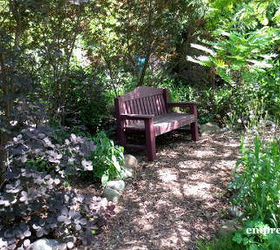 10 charming seating areas from the garden charmers, gardening, outdoor furniture, outdoor living, painted furniture, pallet, Garden Bench on a Shady pathway