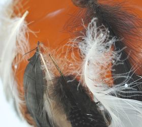 fun fall decor feathered pumpkin, crafts, seasonal holiday decor, thanksgiving decorations, STEP 5 Step Five As you get toward the bottom turn pumpkin upside down so you can see better on top of a cup to hold it off the table Continue to glue and trim as usual