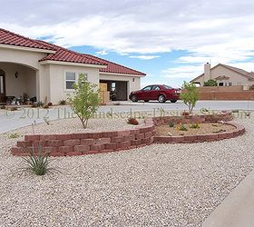 desert southwest landscaping on a small hillside circular driveway using retaining, Downhill side view of the two level retaining wall gives a better idea of how much slope there is on this circular driveway and front yard