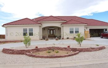 Desert Southwest landscaping on a small hillside circular driveway using retaining walls and Xeriscaping principles and