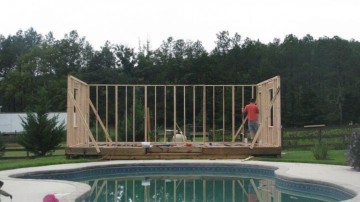 old store pool house, curb appeal, diy, home improvement, outdoor living, This is my husband Mark framing up the poolhouse