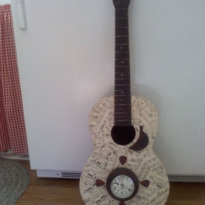 decoupaged guitar turned into wall clock, crafts, decoupage, home decor, repurposing upcycling