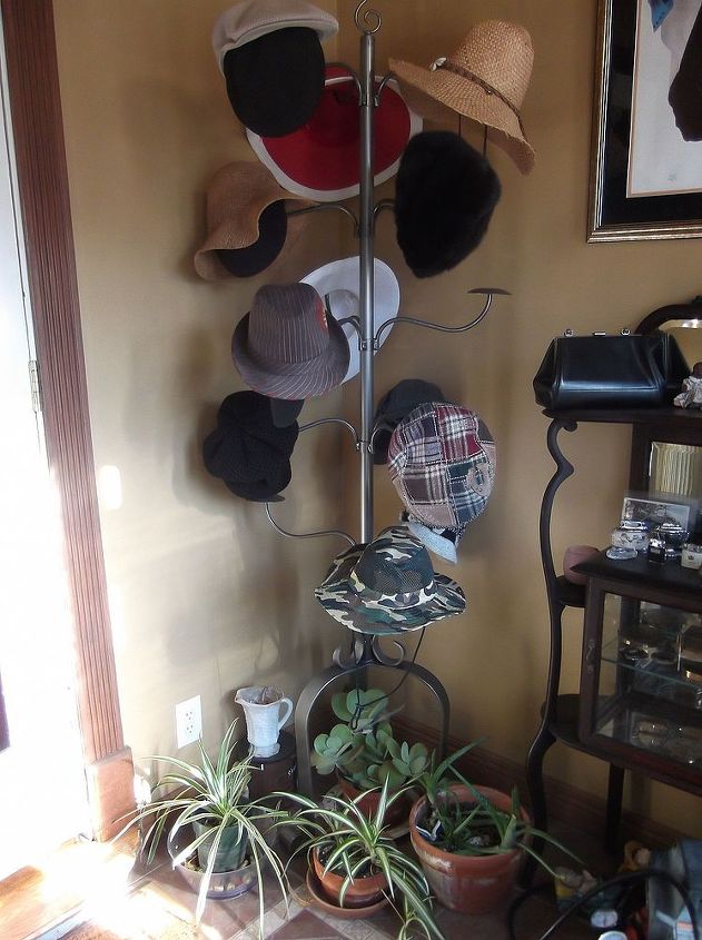 the welcoming plant station, foyer, gardening, She snagged this cute hat rack at a Store Closing sale when they were selling the display items I see her plants resting nicely underneath