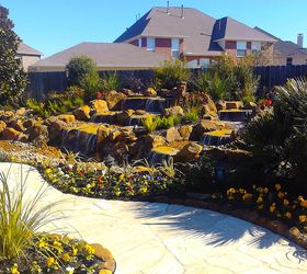 stunning pondless waterfall is the focal point of this backyard near houston texas, landscape, outdoor living, ponds water features, Completed water feature with landscaping and pathway